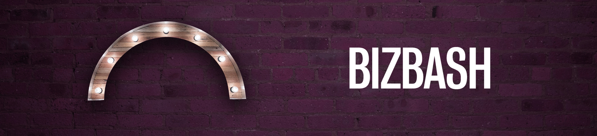 Marquee-style arch Proscenium logo and BizBash logo on a plum-colored brick wall background.