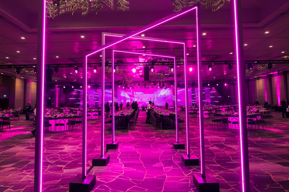 Photo of an Entrance to a dining area with magenta geometric arches
